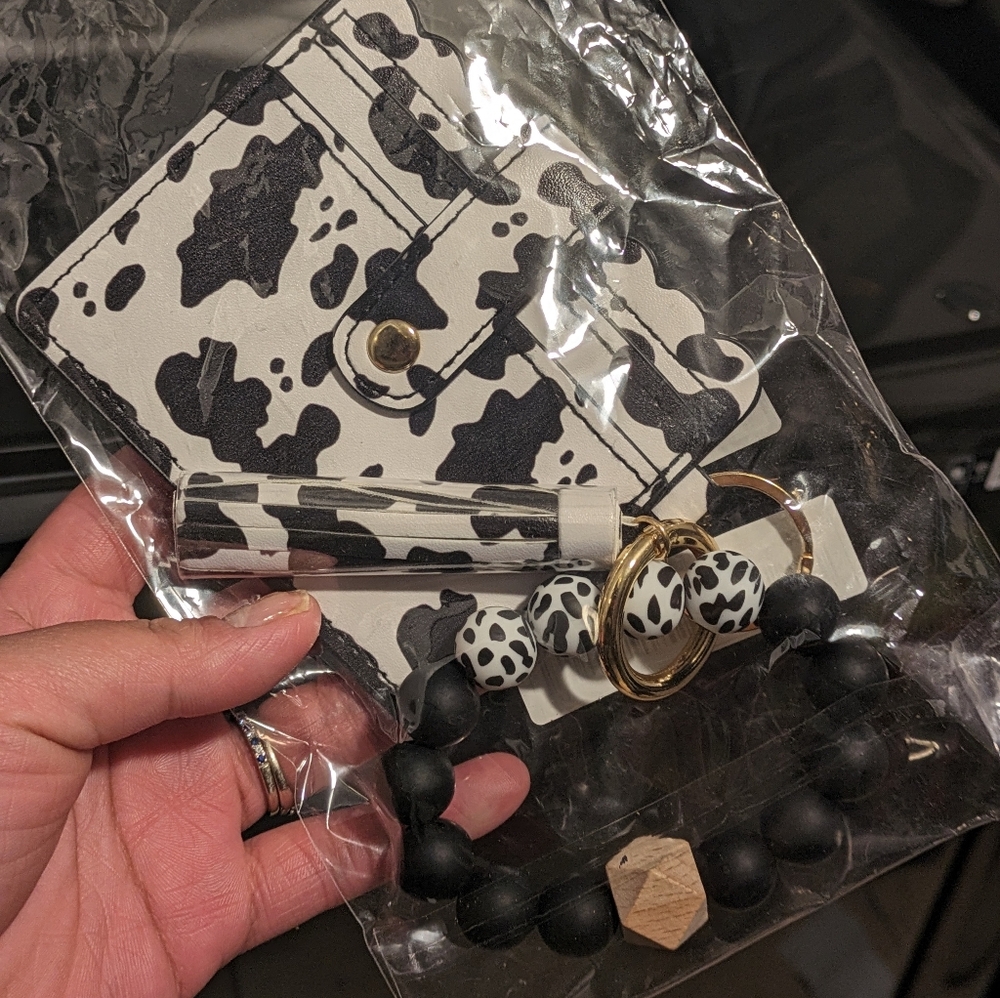 Cow print wallet with beaded bracelet